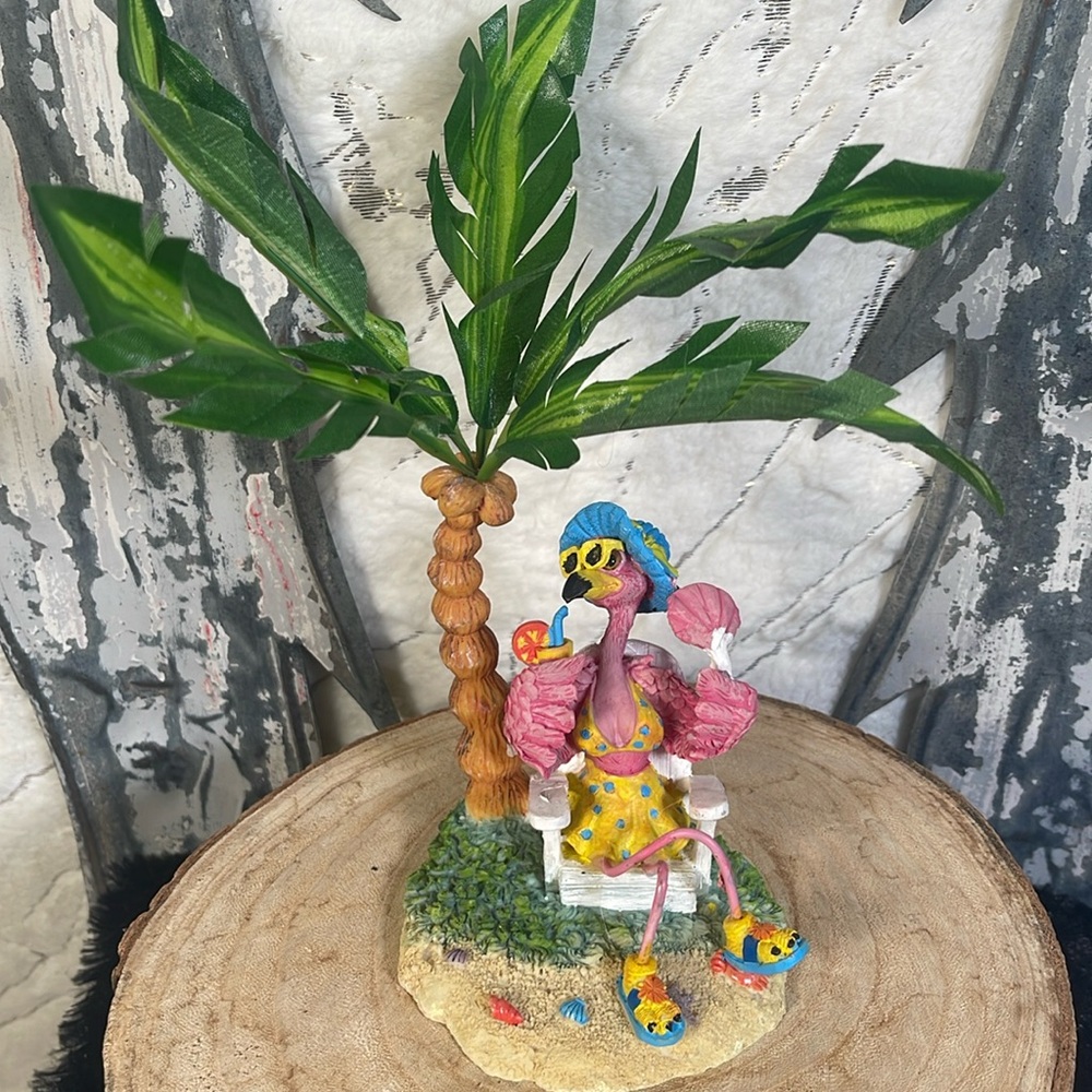 Tropical 🏝️ ceramic flamingo 🦩 with palm.